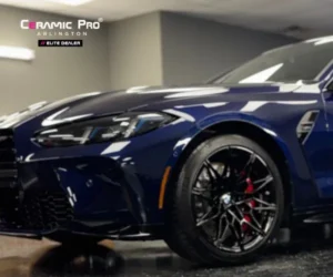 iew of the dark blue BMW coupe showcasing the full side profile